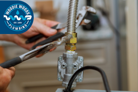 hands connecting a gas line